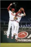  ?? THE ASSOCIATED PRESS FILE ?? Versatile Phillies infielder J.P. Crawford, left, has shown great leaping ability after games with teammate Rhys Hoskins. But Crawford has also shown enough during games to prove he has truly arrived in the majors.