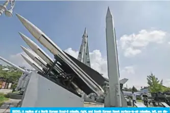  ?? —AFP ?? SEOUL: A replica of a North Korean Scud-B missile, right, and South Korean Hawk surface-to-air missiles, left, are displayed at the Korean War Memorial in Seoul.