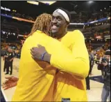  ?? Associated Press ?? Indiana Pacers forward Pascal Siakam, right, gets a hug from teammate James Johnson after Game 6 against the Milwaukee Bucks in a first-round playoff series on Thursday in Indianapol­is.