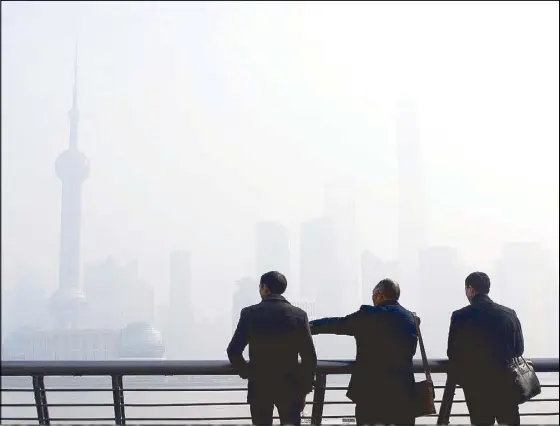  ?? AFP ?? It isn’t only Beijing that suffers from severe haze. Even Pudong in Shanghai is shrouded in haze so thick that it could be seen from outer space, according to satellite photograph­s from NASA.