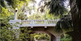  ??  ?? The historic Washington Street Bridge crosses over Dickson Azalea Park in Orlando.