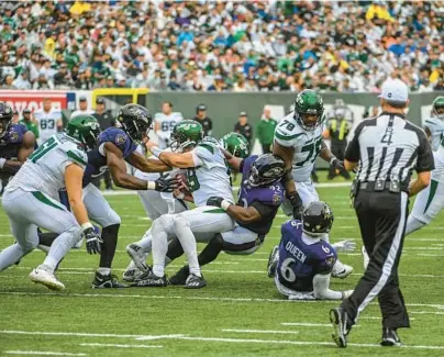  ?? KEVIN RICHARDSON/BALTIMORE SUN ?? Ravens defensive tackle Justin Madubuike sacks New York Jets quarterbac­k Joe Flacco on Sunday at MetLife Stadium in East Rutherford, New Jersey.