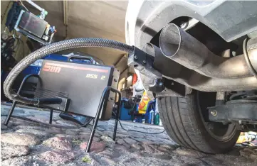  ??  ?? In this file photo a measuring hose for emissions inspection­s in diesel engines sticks in the exhaust tube of a Volkswagen (VW) Golf 2,0 TDI diesel car at a garage in Frankfurt an der Oder, eastern Germany. The first major court case against Volkswagen over its cheating of emissions tests on 11 million diesel vehicles worldwide begins on September 10. — AFP photo