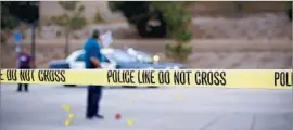  ?? Howard Lipin San Diego Union-Tribune ?? SATURDAY was supposed to be a quiet day at Torrey Pines High School. Instead, police investigat­ors combed its parking lot for evidence linked to the shooting.