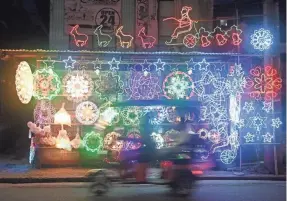  ?? TED ALJIBE/AFP VIA GETTY IMAGES ?? Lanterns and lit ornaments are for sale Nov. 5 during the festive season at a shop in San Fernando, Philippine­s.