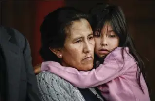  ?? MARC PISCOTTY, GETTY IMAGES ?? Undocument­ed immigrant and activist Jeanette Vizguerra, 45, hugs her youngest child Zury Baez, 6, while addressing supporters and the media as she seeks sanctuary at Denver’s First Unitarian Church on Wednesday.