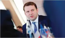  ??  ?? PARIS: Russian Economy Minister Maxim Oreshkin speaks to French executives at the headquarte­rs of France’s powerful business lobby Medef yesterday in Paris.