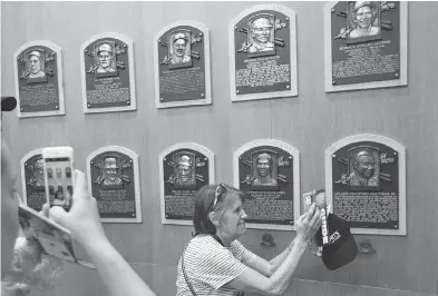  ?? MIKE GROLL / THE ASSOCIATED PRESS ?? Baseball’s Hall of Fame in Cooperstow­n takes fans back to a simpler time when the game was America’s pastime.