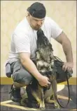  ?? Darrell Sapp/Post-Gazette ?? Army veteran Mitchell Baldwin of Harrisburg gets a kiss from his service dog, Oliver, in 2016.