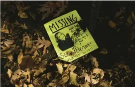  ?? BONNIE TRAFELET/CHICAGO TRIBUNE ?? A flyer is left behind as friends and family of Stacy Peterson search Knoch Knolls Park in Naperville in 2007.