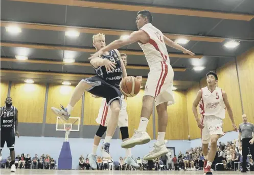  ??  ?? 0 Jonny Bunyan, pictured in blue in action for Glasgow Rocks against Falkirk Fury, is one of seven Rocks players in the Scotland squad.