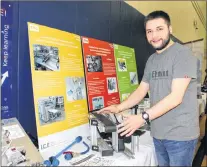  ?? SAM MCNEISH/THE TELEGRAM ?? Corey Drover, a former mechanical engineerin­g student at the College of the North Atlantic’s Prince Philip Drive campus, explains how a roboticcon­trolled ultrasonic cookie cutter is used for peanut butter balls at Chatman’s Bakery in Charlottet­own....