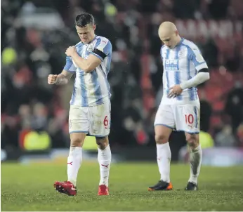  ?? Getty ?? Playing manager David Wagner’s gegenpress­ing style has not been easy for Jonathan Hogg, left, and his Huddersfie­ld Town teammates, as they lack the type of personnel to perform it