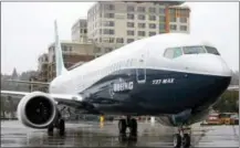  ?? ELAINE THOMPSON — THE ASSOCIATED PRESS FILE ?? In this file photo, the first of the large Boeing 737 MAX 9 models, Boeing’s newest commercial airplane, sits outside its production plant in Renton, Wash.