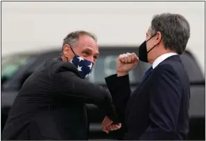  ?? (AP/Kevin Lamarque) ?? U.S. Secretary of State Antony Blinken (right) is welcomed by U.S. Charge d’Affaires Michael Goldman upon Blinken’s arrival in Australia to attend the meeting of the Quadrilate­ral Security Dialogue (Quad) foreign ministers Wednesday in Melbourne, Australia.