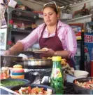  ??  ?? ‘Buen provecho!’ Tacos being made at a taqueria in Baja California. Photograph: Tom Kevill Davies/The Guardian