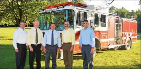  ??  ?? Delaware County Councilman Dave White, District Attorney Jack Whelan and Delaware County Emergency Services Director Tim Boyce joined officials from Aqua Pennsylvan­ia for an annual picnic at Springton Lake Park on Aug. 23 held to honor and thank local...