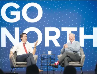  ?? FRANK GUNN / THE CANADIAN PRESS ?? Prime Minister Justin Trudeau shares a laugh with executive chairman of Alphabet Inc. Eric Schmidt at the Google Go North conference. Eric Schmidt singled out Canada’s contributi­on to work in artificial intelligen­ce.