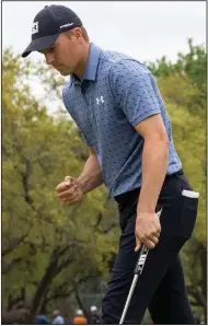  ?? (AP/Michael Thomas) ?? Jordan Spieth celebrates his putt on the 14th hole during the final round of the Texas Open on Sunday in San Antonio. Spieth won his first tournament since earning the British Open title in 2017, holding off Charley Hoffman for a two-shot victory at TPC San Antonio.