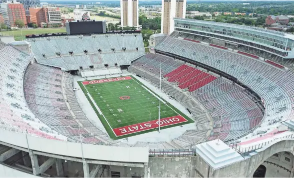  ?? DORAL CHENOWETH/COLUMBUS DISPATCH ?? Ohio Stadium, which was built for $1.5 million and opened in 1922, has become more than just a place where Ohio State plays football. It’s an iconic structure revered in Ohio and recognized far and wide.