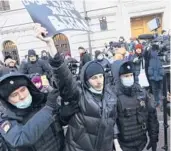  ?? ?? Police detain a demonstrat­or Tuesday in front of the Supreme Court of the Russian Federation in Moscow. The court shuttered a prominent human rights organizati­on.