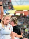  ?? PHOTOSPORT ?? Black Ferns players celebrate a try against England during the final of the women’s Rugby World Cup at Eden Park in Auckland last night.