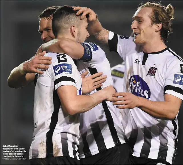  ?? Photos: Seb Daly/Sportsfile ?? John Mountney celebrates with teammates after scoring his side’s second goal at the Carlisle Grounds. x