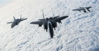  ?? Picture: Reuters ?? An RAF F-35B Lightning, a USAF F-15E Strike Eagle and a French Rafale fly over the English Channel in formation during the ‘Point Blank’ exercise, after taking off from RAF Mildenhall in Britain on Tuesday.