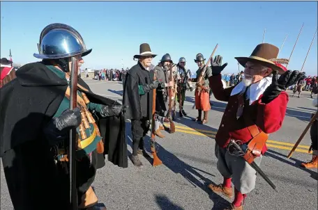  ?? STUART CAHILL — BOSTON HERALD ?? The New Plymouth Guard prepare at the annual Plymouth Thanksgivi­ng Parade on Saturday.