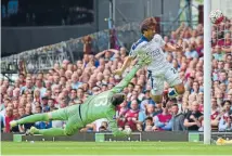  ?? Photo: GETTY IMAGES ?? Table topping Leicester’s Shinji Okazaki nails his team’s first goal in a 2-1 win over West Ham yesterday.