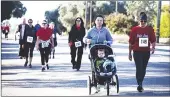  ?? Courtesy photo ?? More than 50 people from around the county laced up their running shoes in October 2019 for the seventh annual Arbuckle Almond Fun Run/walk.