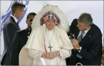  ?? ASSOCIATED PRESS FILE PHOTO ?? Pope Francis dons a headdress that was gifted to him during a visit with Indigenous peoples at Maskwaci, the former Ermineskin Residentia­l School, July 25, 2022, in Maskwacis, Alberta.