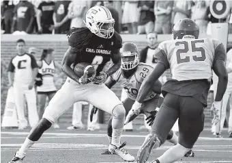  ?? STAFF FILE PHOTO BY ROBIN RUDD ?? UTC wide receiver Alphonso Stewart prepares to dive into the end zone for a touchdown during the 2016 season opener against Shorter. Off the field, Stewart is providing behind-the-scenes help for other UTC sports.