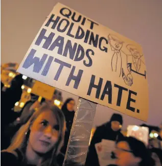  ??  ?? >
Hundreds protested in Birmingham’s Victoria Square on Monday over plans by President Donald Trump to ban entry to people from seven countries to the US