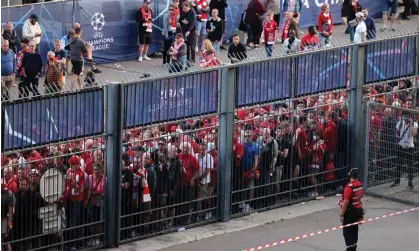  ?? Photograph: Thomas Coex/AFP/Getty Images ?? Liverpool fans were penned in before the 2022 Champions League final.