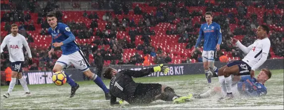  ??  ?? Ryan Delaney from New Ross, the Rochdale centre-half (left), is close to the scene as Kyle Walker-Peters scores the sixth and final goal for Spurs in Wednesday’s FA Cup fifth round replay in Wembley. The Premier League side won 6-1 on Delaney’s...