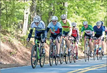  ?? Steven Eckhoff / RN-T ?? A pack of riders head back on Old Dalton Road on Saturday during this year’s Up the Creek without a Pedal cycling event.