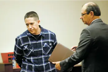  ?? LUIS SÁNCHEZ SATURNO/THE NEW MEXICAN ?? Jerome Block Jr. walks out of District Court with his attorney, Juan Valencia, after taking a plea deal in front of Judge Mary Marlowe Sommer on Friday.