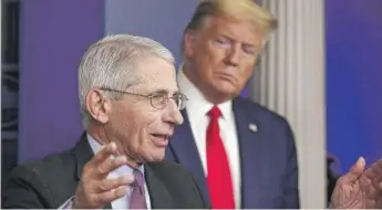  ?? ALEX BRANDON/AP ?? President Donald Trump watches as Dr. Anthony Fauci speaks about the coronaviru­s on April 22.