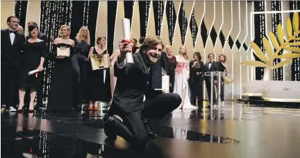  ?? ALASTAIR GRANT/THE ASSOCIATED PRESS ?? Director Ruben Östlund celebrates winning the Cannes Film Festival's Palme d'Or for his movie The Square.