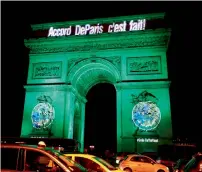  ?? Reuters ?? The Arc de Triomphe in Paris is illuminate­d in green with words ‘Paris Agreement is Done’, to celebrate Climate accord. —