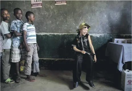  ?? AFP ?? A boy waits to be immunised with the measles, mumps and rubella vaccine in Tanzania