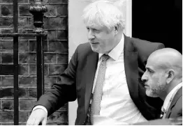 ?? AP ?? Britain’s Prime Minister Boris Johnson (left) leaves 10 Downing Street in London on Thursday.