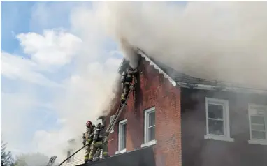  ?? JANA CHYTILOVA / OTTAWA CITIZEN ?? Firefighte­rs battle Monday’s two-alarm blaze at 1518 Stittsvill­e Main St. No one was reported injured in the fire.