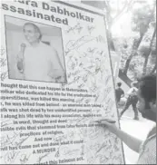  ??  ?? Students of Mumbai University signing on the poster of Dr Dabholkar in support