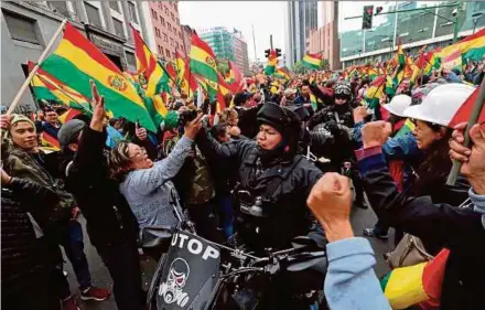  ??  ?? People celebratin­g the resignatio­n of President Evo Morales, in La Paz, Bolivia, on Sunday. EPA PIC