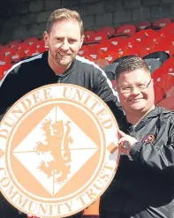  ??  ?? Gordon Grady and Jamie Kirk with the Dundee United Community Trust’s new crest.