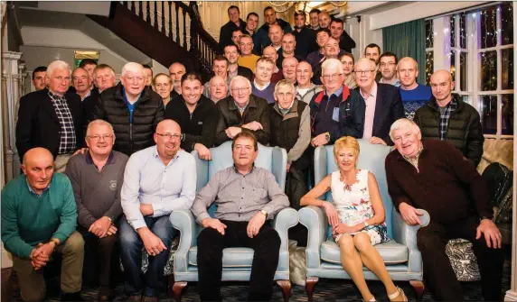  ??  ?? Mike Clifford (seated centre) pictured at the Killarney Avenue Hotel with his wife Margaret and his co workers at Liebherr in celebratin­g his retirement after almost 47 years of service. Picture Marie Carroll-O’Sullivan