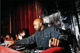  ?? AMY LOMBARD/THE NEW YORK TIMES ?? Virgil Abloh in D.J. mode at a party hosted by Garage magazine at Rose Bar in New York on Feb. 9, 2018. Abloh, who died on Nov. 29 at 41, repurposed an ethic from hip-hop and skateboard­ing, two cultural pursuits premised upon the provocativ­e and ultimately correct misuse of what came before.