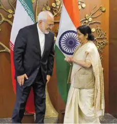  ?? — Reuters ?? Iran’s Foreign Minister Mohammad Javad Zarif with his Indian counterpar­t Sushma Swaraj during a photo opportunit­y in New Delhi, on Monday.